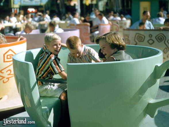 Photo of Mad Tea Party with children spinning a green cup