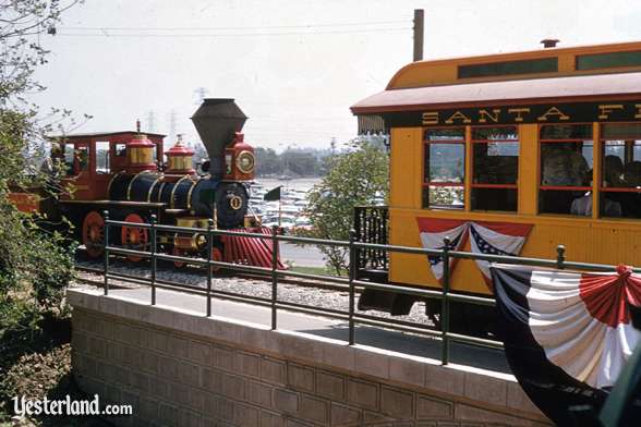 The locomotive C. K. Holliday passes the Grand Canyon observation car