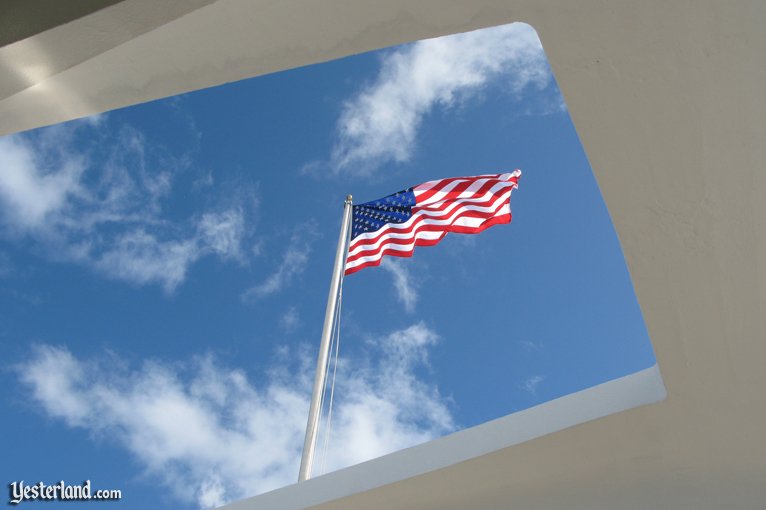 Stars and Stripes flying above the USS Arizona Memorial